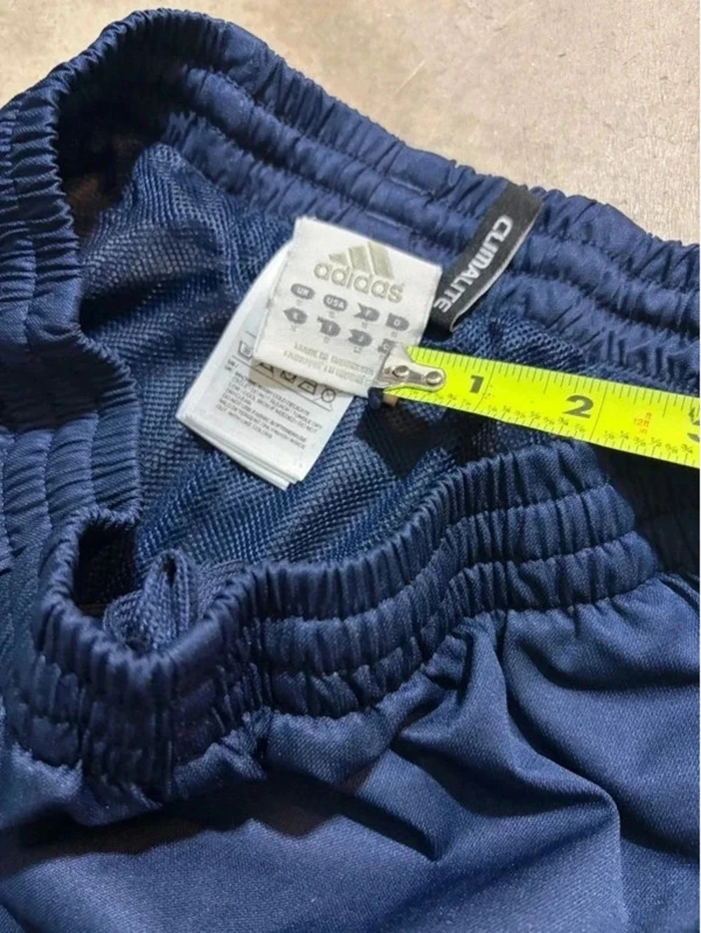Y2K vintage blue and white striped adidas track pants with zipper on ankle